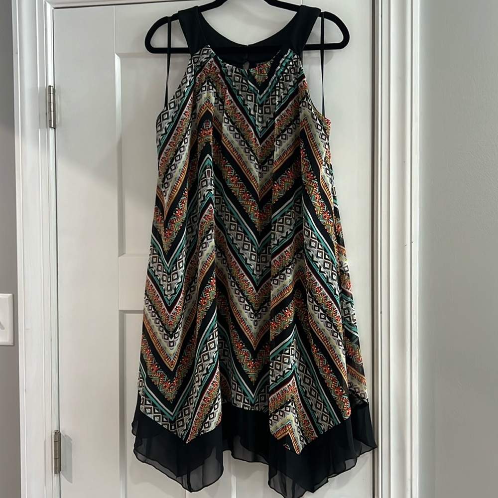 Gorgeous sleeveless dress with ‘chevron’ hem; super fun to dance in